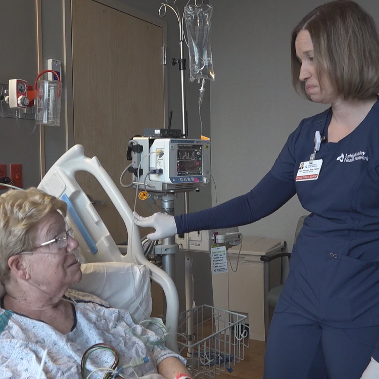   R.N. Tracie Heckman visits with enhanced respiratory monitoring patient Jane McAndrew