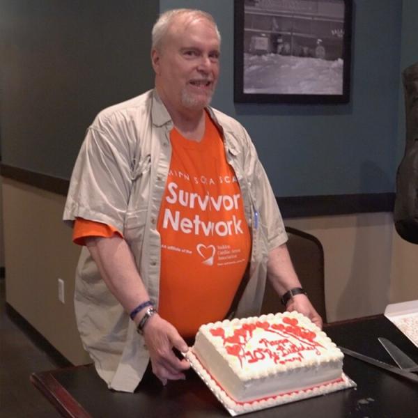 Garry Frankel celebrates his 10th 'Re-Birthday' holding cake