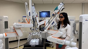 An engineer works with the Hugo™ robotic-assisted-surgery (RAS) system.