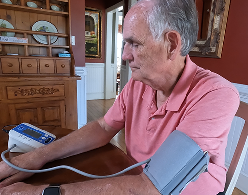 Paul Griffin regularly checks his blood pressure at home.